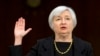 New Fed Chief Faces Reporters