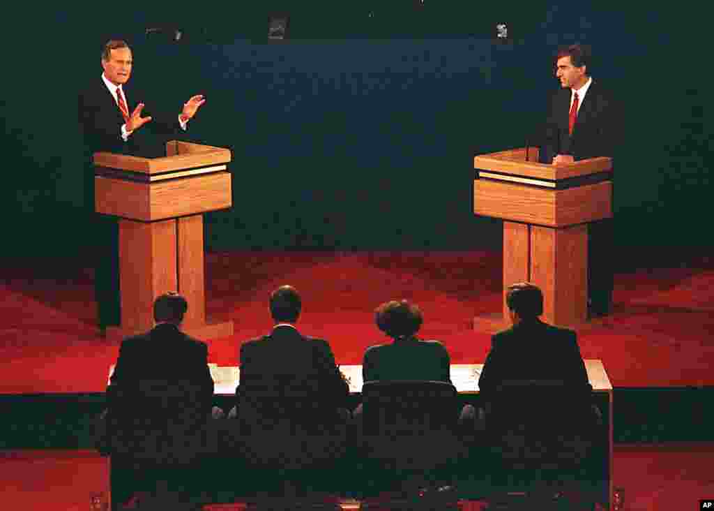 Vice President George Bush, left, and Mass. Gov. Michael Dukakis are shown during their first presidential debate at Wake Forest University in Winston-Salem, North Carolina, Sept. 25, 1988.