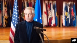 FILE - Secretary of Defense Chuck Hagel addresses the media during his visit to Minot Air Force Base, N.D., Nov. 14, 2014.