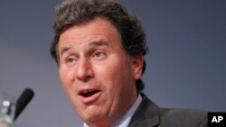 FILE - Oliver Letwin speaks at the Conservative party conference in Birmingham, England. Letwin is under fire for comments made about rioting in Britain in 1985.