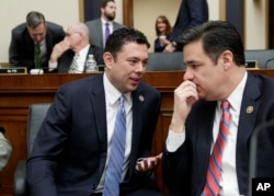FILE - Rep. Jason Chaffetz, R-Utah, left, confers with Rep. Raul Labrador, R-Idaho, as the House Judiciary Committee begins a markup session on the Protecting Access to Care Act on Capitol Hill in Washington.
