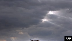 The Athens Acropolis hill is seen at sunset on a cloudy day, November 15, 2011.