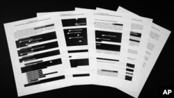 Special counsel Robert Mueller's redacted report on the investigation into Russian interference in the 2016 presidential election is photographed April 18, 2019, in Washington.