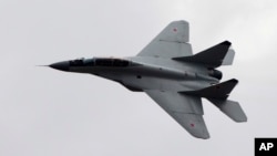 FILE - A Russian MiG-29 plane is seen in flight, in Zhukovsky, outside Moscow, Aug. 11, 2012.