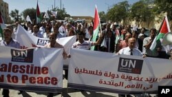 Palestinians march during the launch of a campaign supporting a bid for Palestinian statehood recognition at the UN, in the West Bank city of Ramallah, September 8, 2011.