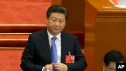 FILE - Chinese President Xi Jinping attends the closing session of the annual National People's Congress in Beijing's Great Hall of the People, March 16, 2016. 