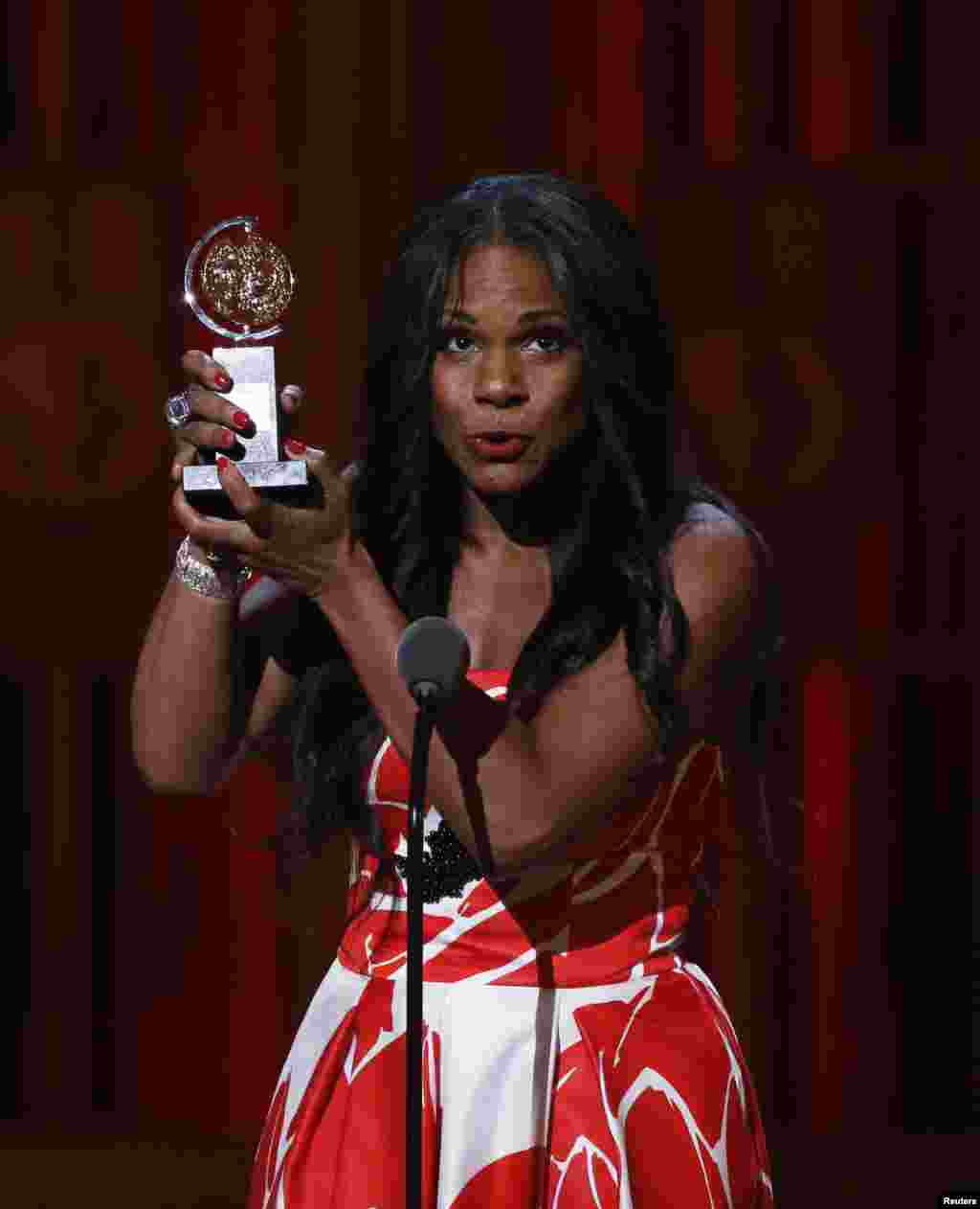Audra McDonald accepts the award for Best Performance by an Actress in a Leading Role in a Play for &quot;Lady Day at Emerson&#39;s Bar &amp; Grill&quot; during the American Theatre Wing&#39;s 68th annual Tony Awards at Radio City Music Hall in New York, June 8, 2014.