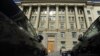 A woman passes by the headquarters of Russia's Rossiya Bank in St. Petersburg, April 4, 2016.