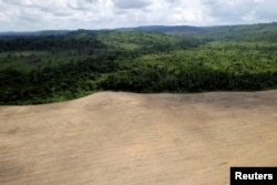 An aerial view of cleared land is seen during an operation to combat illegal mining and logging conducted by agents of the Brazilian Institute for the Environment and Renewable Natural Resources, supported by military police, in the municipality of Novo Progresso, Para State, northern Brazil, Nov. 11, 2016.