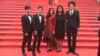 From left to right: Nov Cheanick, Chhem Madeza, Nuon Sobon, Tith Kanitha, Davy Chou posed for a photo on the official red carpet the day of the official screening of the film, Friday 13, May 2016.
Actors' clothes were designed by Colorblind and actress' dress by Kool as U. (Photo: Barbara Lombeek)