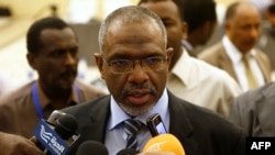 FILE - Prime Minister Moataz Moussa — pictured July 22, 2015, in Khartoum, when he was Sudan's water minister — acknowledged protesters' economic concerns on Feb. 2, 2019. "There are problems and we are working on solving them," he told reporters.