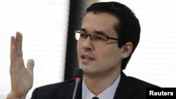Brazilian prosecutor Deltan Dallagnol speaks during the announcement of the proposals by the Federal Public Ministry to combat corruption in Brazil, in Brasilia, March 20, 2015.