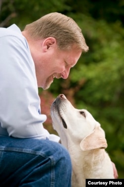 Mark Ruefenacht and Armstrong, the first diabetes alert dog. (Robert Houser Photography)