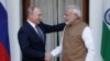 دیدار ولادیمیر پوتین رئیس جمهوری روسیه (چپ) با نارندرا مودی نخست وزیر هند در دهلی نو - ۵ اکتبر ۲۰۱۸ 