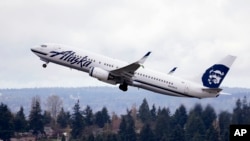 FILE - An Alaska Airlines jet takes off at Seattle-Tacoma International Airport in SeaTac, Washington, March 24, 2015. 