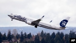 FILE -- A U.N. agency has approved an agreement to limit the growth of air pollution by civil airlines, like this Alaska Airlines flight, and cargo planes. The voluntary phase begins in 2021.
