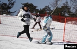 A robot takes part in a practice run at the Ski Robot Challenge at the Welli Hilli ski resort in Hoenseong, South Korea, February 12, 2018. REUTERS/Kim Hong-Ji