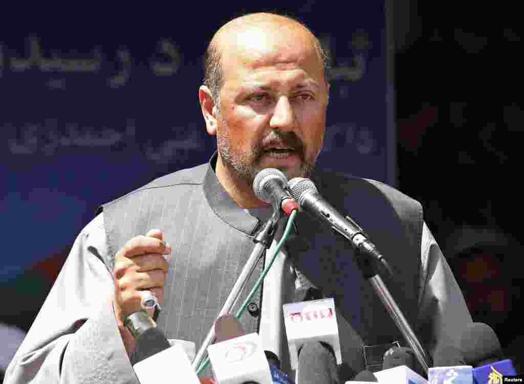 Hashmat Karzai, cousin of Afghan President Hamid Karzai, and a close and powerful ally of presidential candidate Ashraf Ghani, was killed in a suicide bomb attack on July 29, 2014. In this photo, he speaks during a news conference in Kandahar, March 28, 2014.