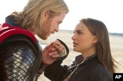 Left to right: Thor (Chris Hemsworth) and Jane Foster (Natalie Portman) in THOR, from Paramount Pictures and Marvel Entertainment.