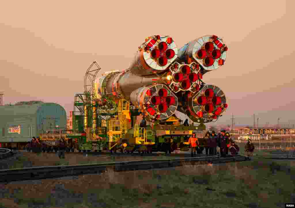 The Soyuz TMA-11M rocket is rolled out to the launch pad by train at the Baikonur Cosmodrome in Kazakhstan.