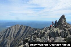 Appalachian Trail hikers end their journey at the top of Mount Katahdin