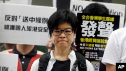 Taiwanese people gather to support Hong Kong people as the administration prepares to open debate on a highly controversial extradition law, in front of Hong Kong Economic, Trade and Culture Office in Taipei, Taiwan, June 12, 2019.