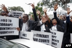 Lawyers of the Law Society of Zimbabwe bar association take part in a "March for Justice" toward the Constitutional Court in Harare on Jan. 29, 2019, to call for restoration of the rule of law, respect of human rights as well as the country's Constitution