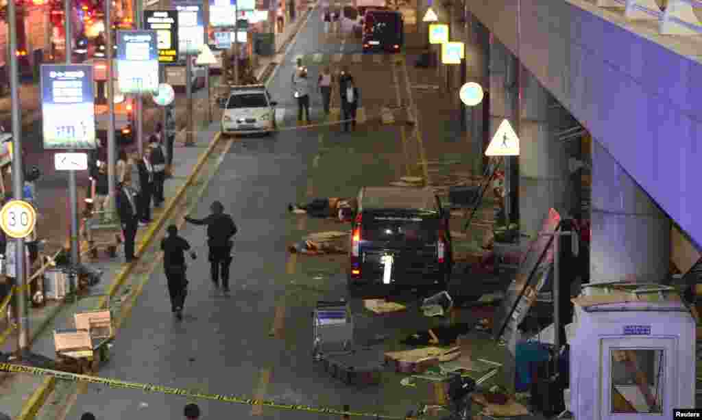 Bodies are seen outside Turkey's largest airport, Istanbul Ataturk, following several blasts, June 28, 2016.