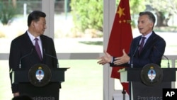 China's President Xi Jinping, left, listens to Argentina's President Mauricio Macri during a joint press conference at the presidential residence in Olivos, a northern suburb of Buenos Aires, Argentina, Dec. 2, 2018.