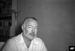 FILE - Ernest Hemingway is seen at his country home in San Francisco de Paula near Havana, Cuba, Aug. 21, 1950.