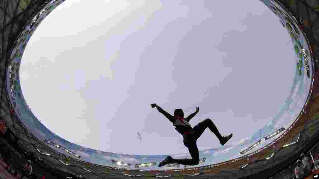 Cuba&#39;s Maykel D. Masso competes in men&#39;s long jump qualification at the World Athletics Championships at the Bird&#39;s Nest stadium in Beijing, Monday, Aug. 24, 2015