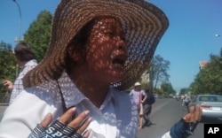 An identified woman, Boeung Kak lake protester, crying at the demonstration Monday.