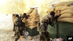 Somali government soldiers man a position in Mogadishu on April 30, 2011