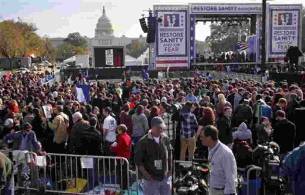 People gather near the stage for the Rally to Restore Sanity and/or Fear event on the National Mall in Washington, 30 Oct 2010