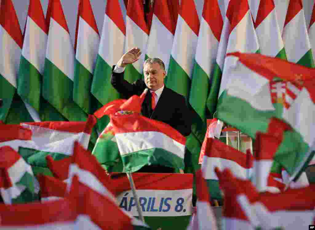 Prime Minister Viktor Orban waves during the final electoral rally of his Fidesz party in Szekesfehervar, Hungary.