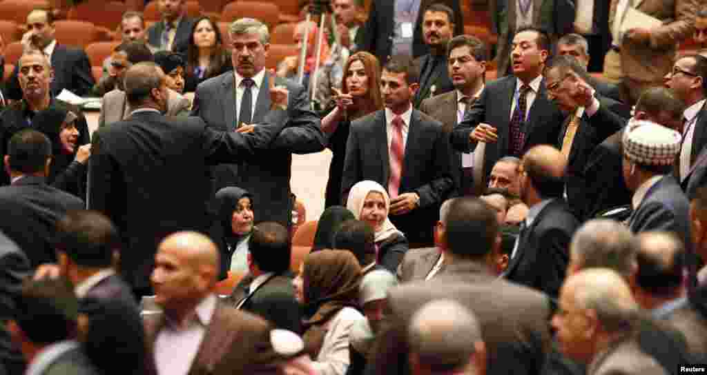 Some members of the newly elected Iraqi parliament point fingers at each other after an argument broke out at the parliament headquarters in Baghdad.