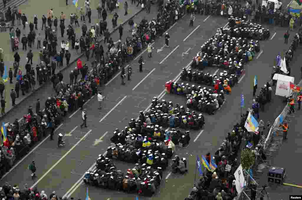 Pro-European integration protesters form the Ukranian word &quot;Lustration&quot; at Independence Square in Kyiv.