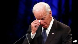 Former Vice President Joe Biden wipes a tear away while giving a tribute during memorial service at North Phoenix Baptist Church for Sen. John McCain, R-Ariz., on Aug. 30, 2018, in Phoenix, Ariz. 