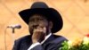 FILE - South Sudan President Salva Kiir attends the signing of a peace agreement with South Sudan rebel groups in Khartoum, Sudan, June 27, 2018. 