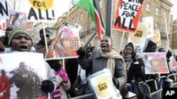 Protesters calling on the British Government intervention to prevent war in Sudan are pictured opposite 10 Downing St. in London, 09 Jan 2010