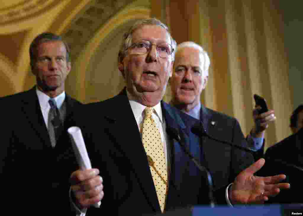 Senate Republican leader Mitch McConnell speaks to reporters after the Republican party policy luncheon in the Capitol in Washington, Sept. 16, 2014. 