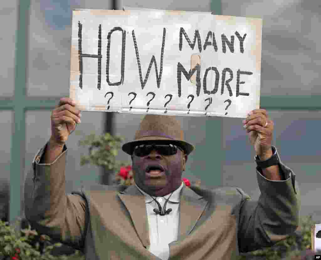 Rev. Arthur Prioleau holds a sign during a protest at city hall in North Charleston, South Carolina, USA, after shooting death of Walter Scott. Scott was killed by a North Charleston police officer after a traffic stop on April 3. 
