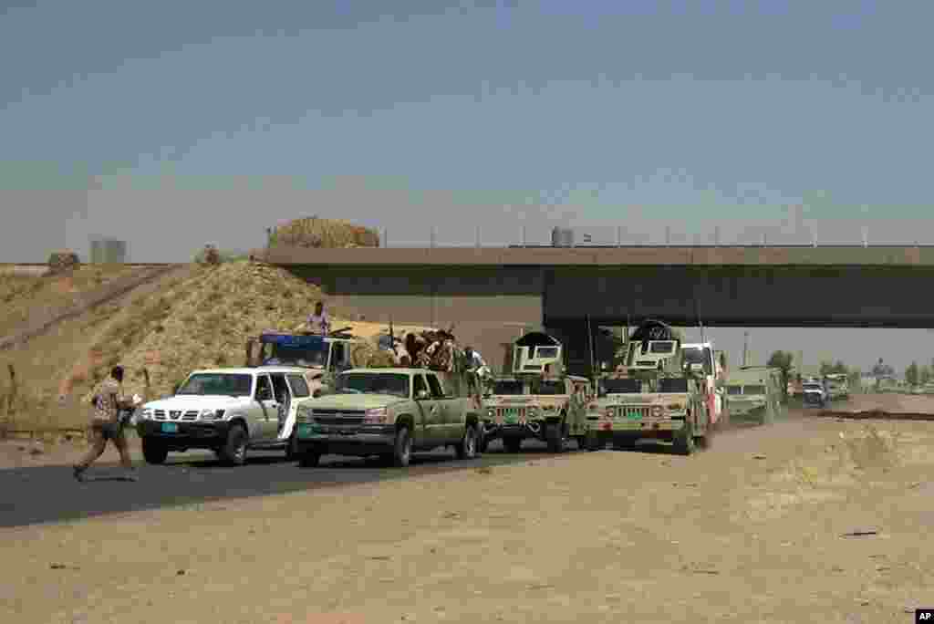 Iraqi security forces head to Baghdad on the main road between Baghdad and Mosul, a day after fighters from the Islamic State of Iraq and the Levant took control of much of Mosul, Iraq, June 11, 2014.