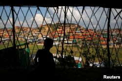 View of temporary shelters is seen through the shelter at Palong Khali refugee camp, near Cox's Bazar, Bangladesh, Nov. 14, 2017.