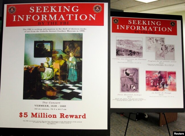 FILE - Posters displaying stolen works by artists Johannes Vermeer and Edgar Degas from the Isabella Stewart Gardner Museum in Boston, Massachusetts March March 18, 2013. The FBI is offering a 5 million dollar reward for the return of the paintings. (REUTERS/Jessica Rinaldi/File)