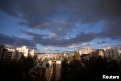 A double rainbow is seen over a northen neighborhood in Quito, Ecuador, Nov. 5, 2016.