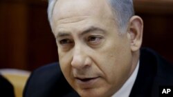 Israeli Prime Minister Benjamin Netanyahu chairs a weekly cabinet meeting at his office in Jerusalem, Dec. 22, 2013.