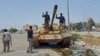 Des troupes pro-gouvernementales lors des combats à Benghazi, Libye, 21 mai 2015.