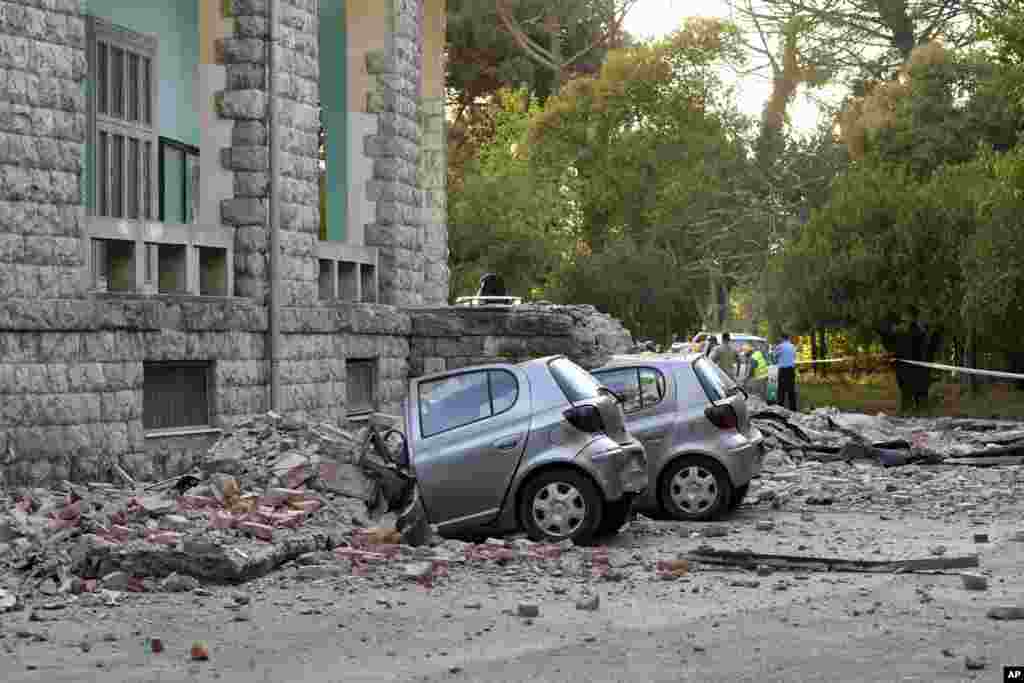 Damaged cars outside the Faculty of Geology building after an earthquake in Tirana, Sept. 21, 2019. Albania&#39;s government and news reports say an earthquake with a preliminary magnitude of 5.8 shook in the country&#39;s west and injured at least two people.