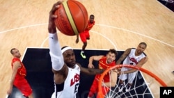 United States' LeBron James (6) dunks against Spain during the men's gold medal basketball game at the 2012 Summer Olympics in London on Sunday, Aug. 12, 2012. 
